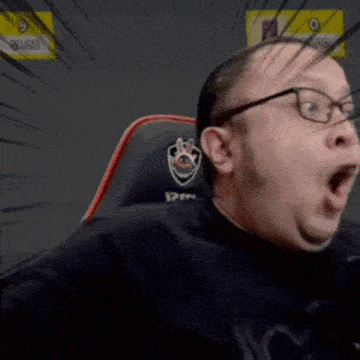 a man wearing glasses is sitting in a chair with a paw logo on it