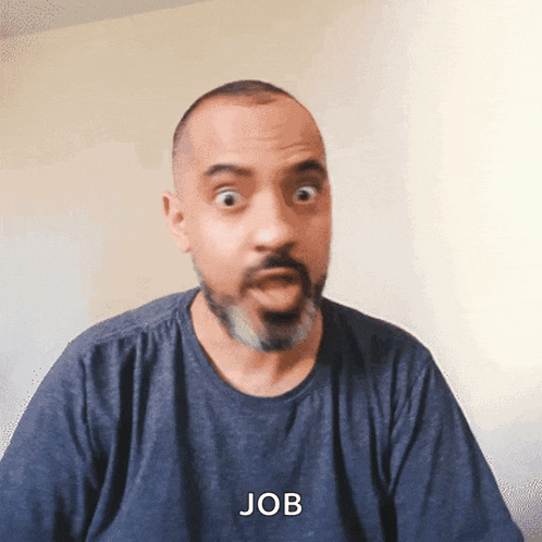 a man with a beard is wearing a blue shirt with the word job on it