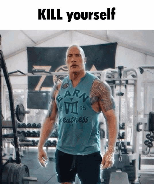 a man in a gym wearing a shirt that says earn vii 95 greatness