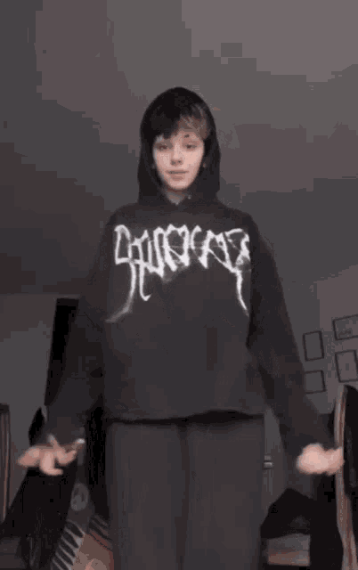 a person wearing a black hoodie that says " lucky " on it