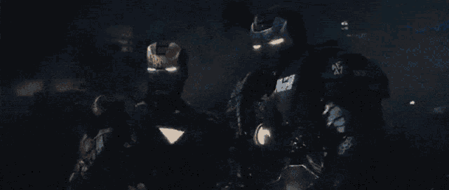 a close up of iron man 's helmet with his eyes glowing