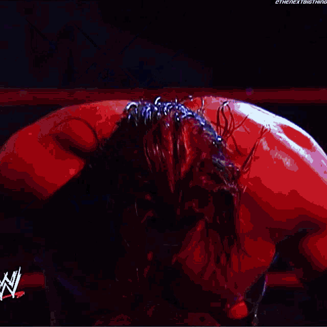 a man is wearing a wrestling belt with a n on it