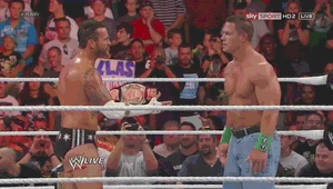 two men in a wrestling ring with a sign in the background that says sky sport hd 2 live