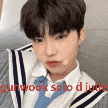 a close up of a person with the words gunwook solo d julie