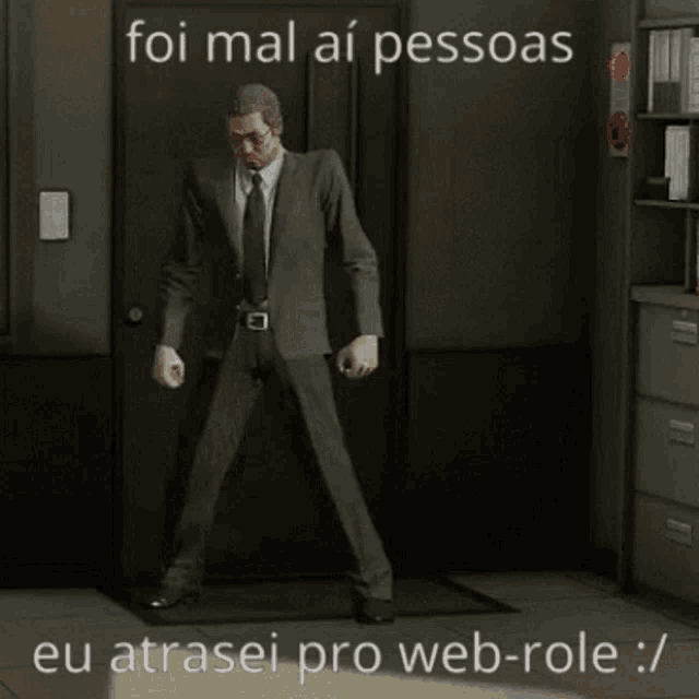 a man in a suit and tie is dancing in a dark room