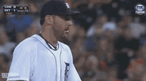a man in a baseball uniform stands in front of a crowd while fox broadcasts the game