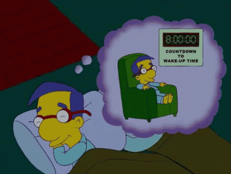 a cartoon character laying in bed with a countdown to wake up time