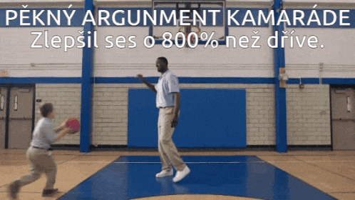 a man and a boy playing basketball in a gym with the words pekny argument kamarade