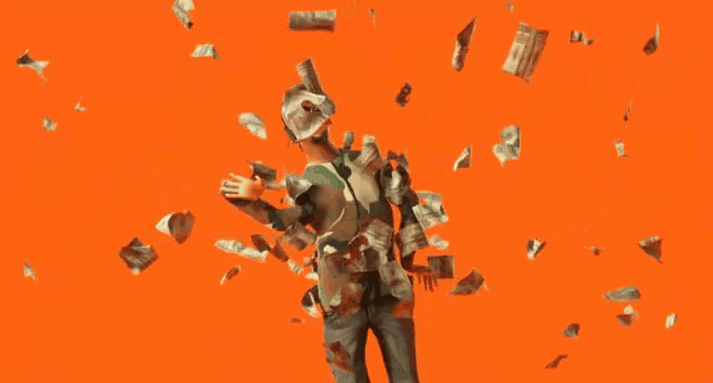 a man in a camo shirt is surrounded by money falling around him