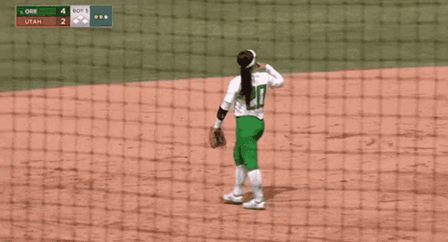 a softball player with the number 21 on their jersey