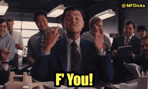 a man in a suit and tie is giving the middle finger with the words f you behind him