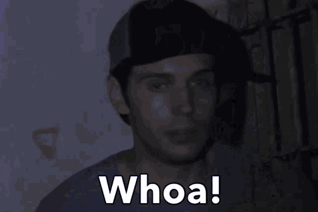 a man is holding a flashlight with the word whoa written on it