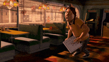 a man in a diner holding a pizza box that says pizza on it