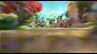 a blurry picture of a cartoon landscape with trees and buildings .