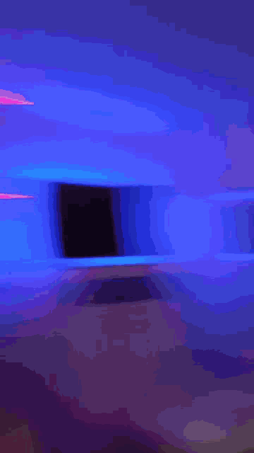 a blurry picture of a woman 's face in a room with a lot of lights .