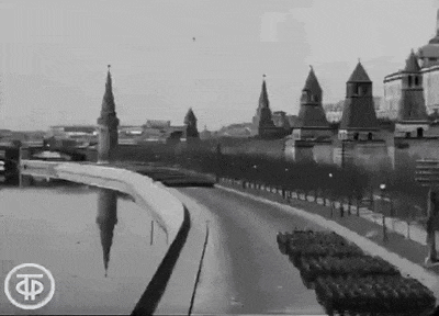 a black and white photo of a city with the letter f on the bottom right corner