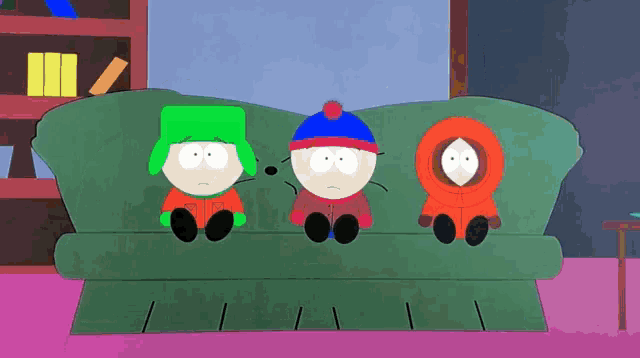 three south park characters sit on a green couch in a living room