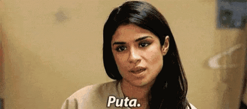 a close up of a woman 's face with the words puta .
