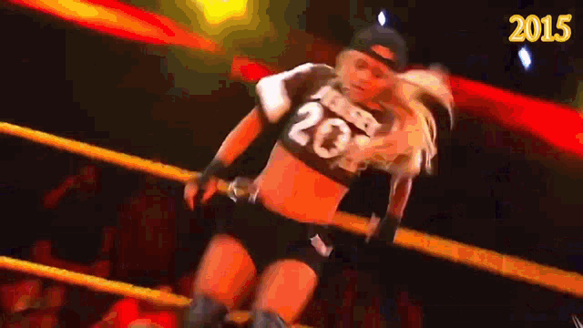 a female wrestler with the number 20 on her top