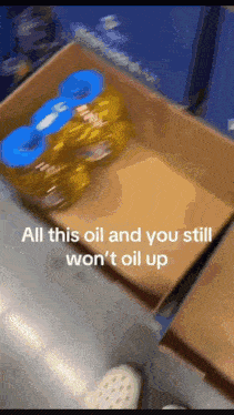 a cardboard box filled with bottles of oil and the words all this oil and you still won 't oil up