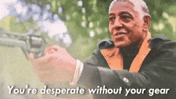 a man holding a gun with the words you 're desperate without your gear