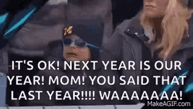 a baby wearing sunglasses and a hat is sitting next to a woman in a car .
