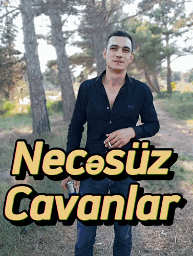 a man in a black shirt stands in a field with the words " necasuz cavanlar " written above him