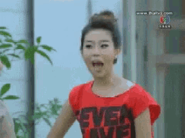 a woman is wearing a red shirt that says " ever love "