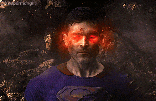 a close up of a man 's face with red eyes and the words supermangifs on the bottom
