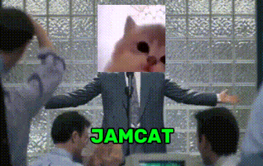 a man in a suit and tie is giving a speech with a picture of a cat on his head and the word jamcat below him