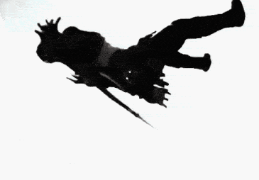 a black and white photo of a person falling into the air