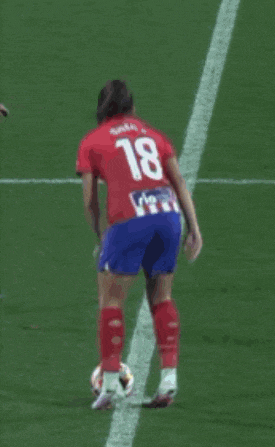 a soccer player with the number 18 on her shirt