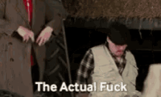 two men are standing next to each other with the words the actual fuck written on the bottom