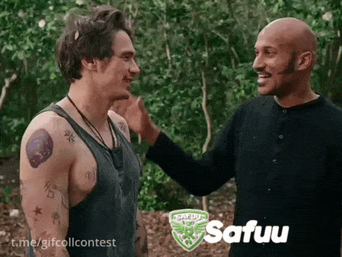 two men are standing next to each other and one of them is wearing a shirt that says safuu on it