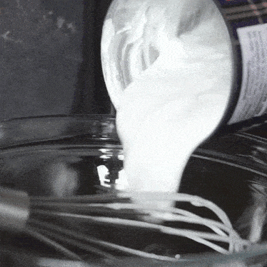 Pouring Coconut Cream Two Plaid Aprons GIF - Pouring Coconut Cream Two Plaid Aprons Preparing The Heavy Cream GIFs