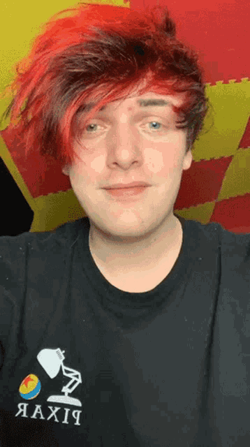 a man with red hair is wearing a black shirt that says fix it
