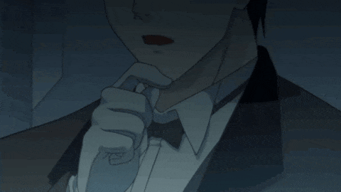 a man in a tuxedo and bow tie is holding his tie in his hand