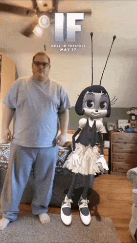 a man standing next to a cartoon character that says if