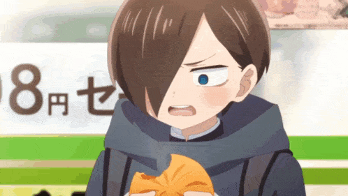 a boy is holding a piece of bread in front of a sign that says 8
