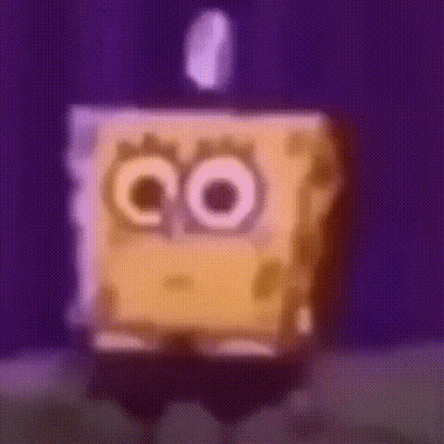 a blurry picture of spongebob squarepants standing in front of a purple curtain .