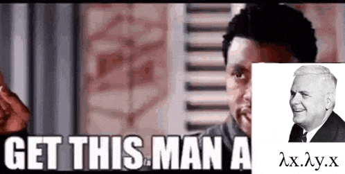 a man with a picture of a man behind him says get this man a ..