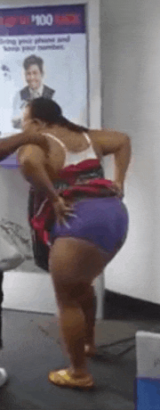 a woman in purple shorts is standing in front of a sign that says 100 bucks