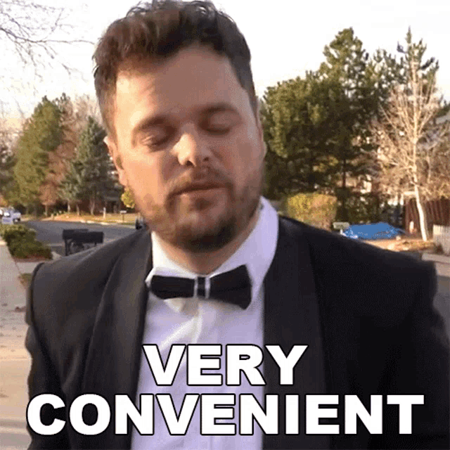 a man wearing a suit and bow tie says " very convenient "