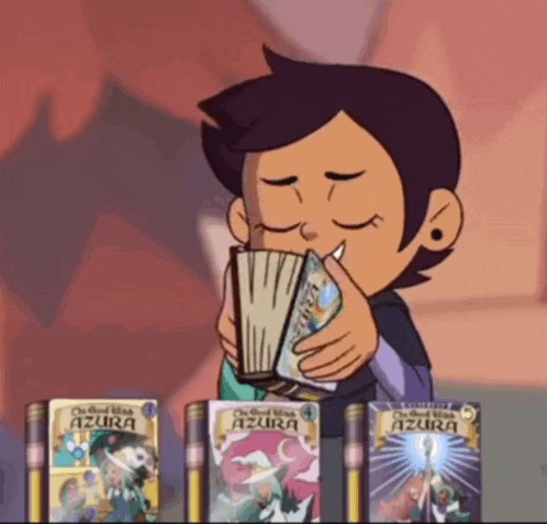 luz from the owl house is holding a book in her hand and smelling it .