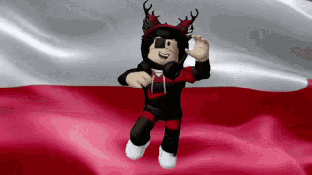a cartoon character with antlers is dancing in front of a red and white flag
