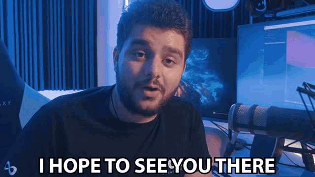 a man says i hope to see you there in front of a computer