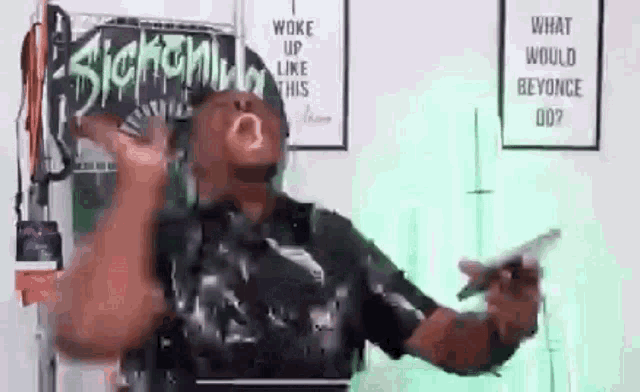 a man is standing in front of a sign that says `` what would beyonce do '' .