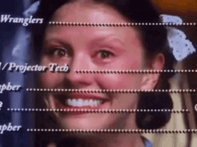 a close up of a woman 's face with the words wranglers and projector tech behind her