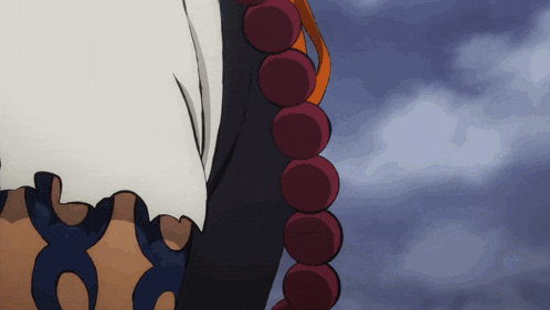 a close up of a person wearing a necklace of beads