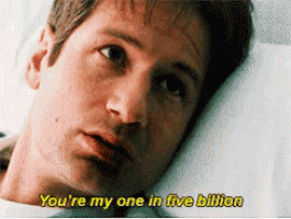 a man laying in a hospital bed with the words you 're my one in five billion